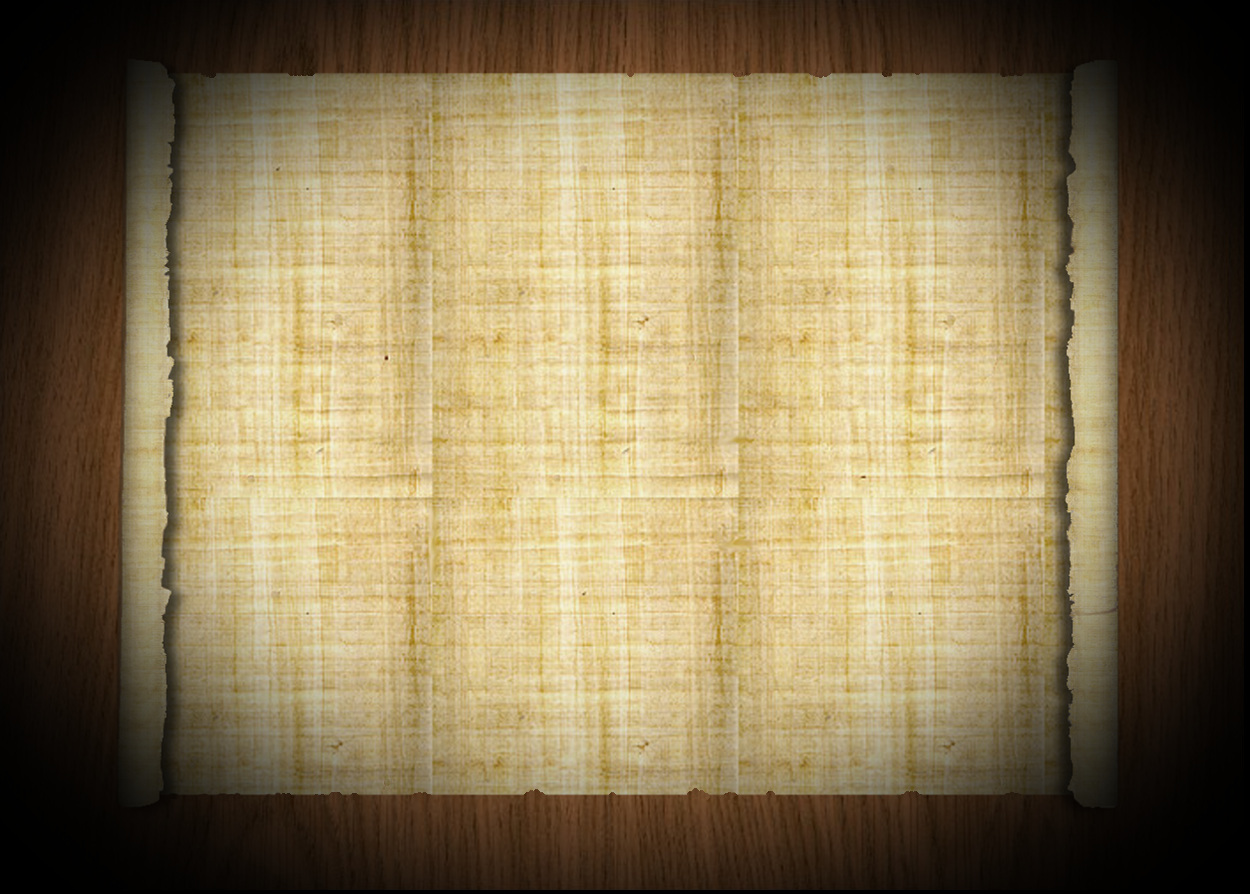 unrolled papyrus on a wooden tabletop